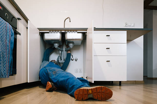 Professional Drain Cleaning technician working in Grinnell, IA